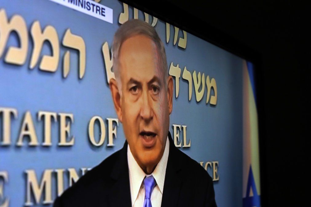 <div>Foto tomada en Jerusalén, de la pantalla de una televisión. Muestra al primer ministro israelí, Benjamin Netanyahu, dando un discurso televisado en la televisión israelí luego de que el presidente de Estados Unidos anunciara que se retiraba del acuerdo nuclear con Irán. Mayo 8, 2018.</div>