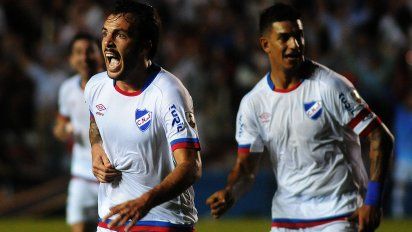 nacional goleo a garcilaso 4-0 y trepo al segundo lugar, detras de santos