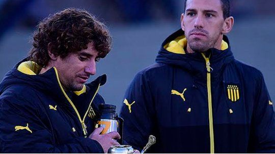 Maxi Rodríguez y Mathías Corujo