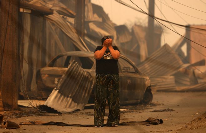 incendio-chile-mujer-llora-AFP