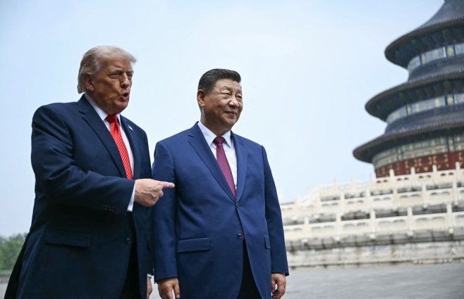 Foto: AFP. Donald Trump posa junto a Xi Jinping en China.