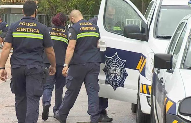 policia-cientifica-patrullero-glock-arma.jpg